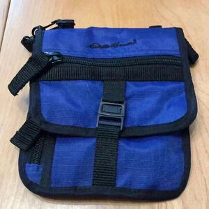 Eddie Bauer blue/black crossbody travel pouch.  Converts to waist pack.